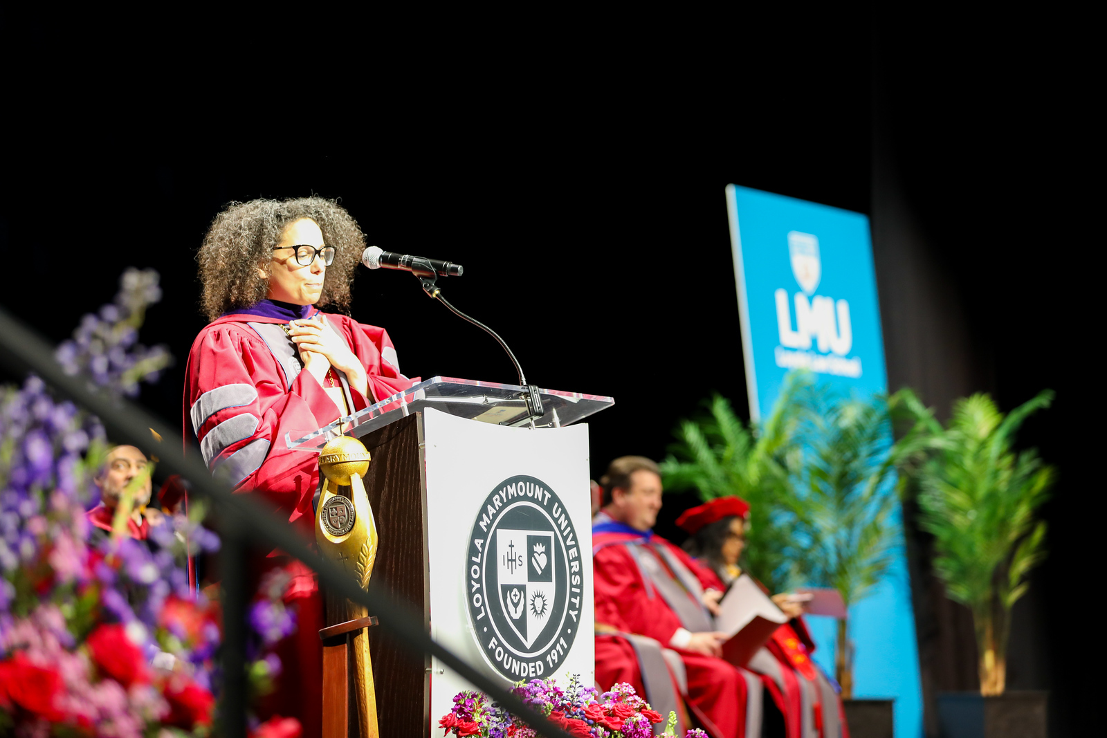 Dean Clark at podium for commencement.